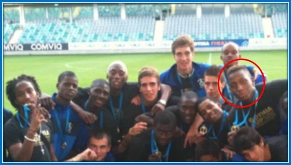 The forward celebrates with his Paris FC academy teammates - after winning a trophy.