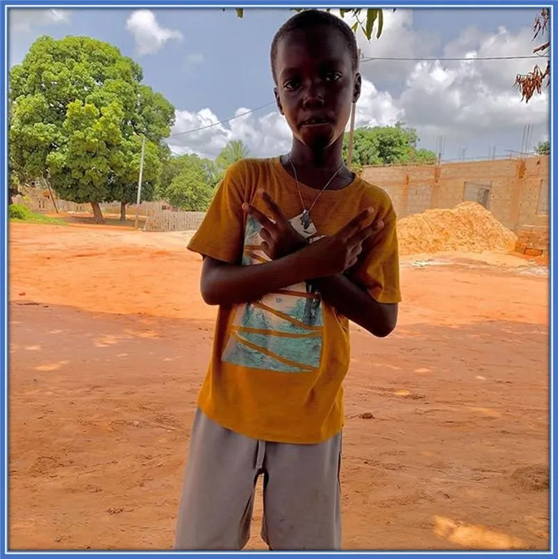 A childhood photo of Christian Valentim Dama, Nicolas Jackson's Brother (older).