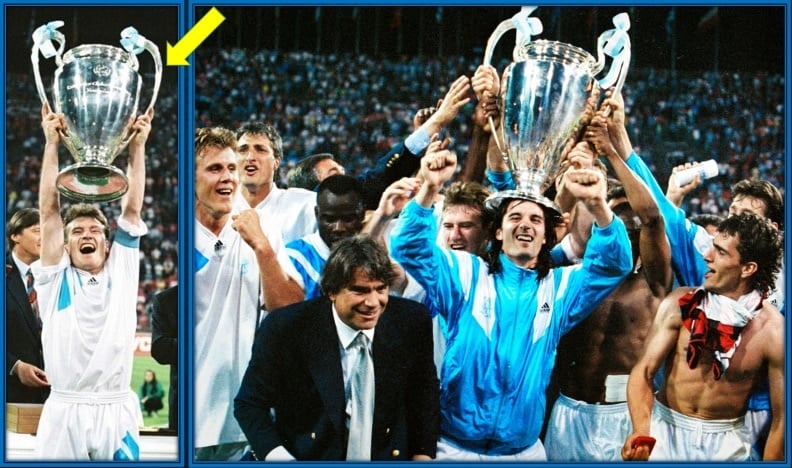 Didier Deschamps lifts the UEFA Champions League trophy in Marseille colours.