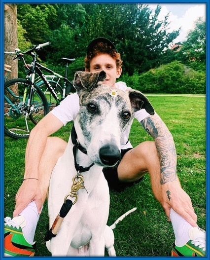 The Forward takes a photo with his dog at a park in Bremen, Germany.