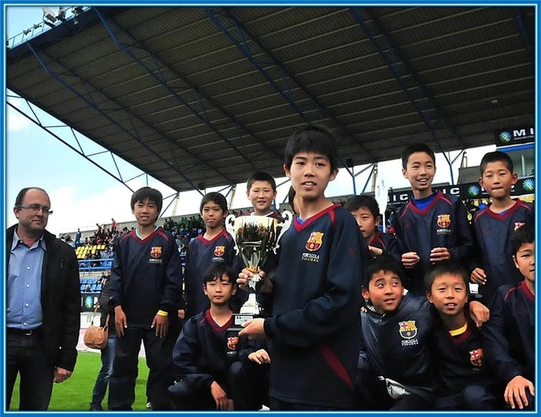 Takehiro Tomiyasu was lifting a trophy for FC Barca Academy.