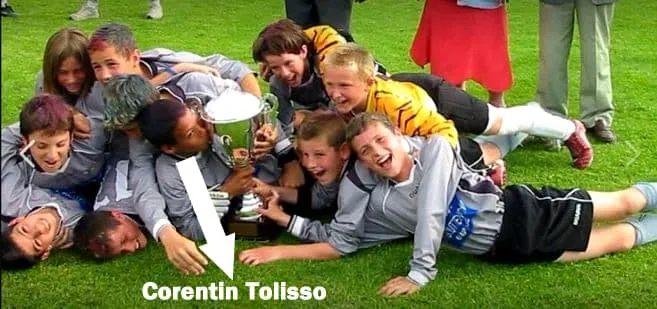 Young Tolisso and his teammates celebrate a cup victory.