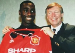 Andy Cole and Sir Alex as he signed for Manchester United.