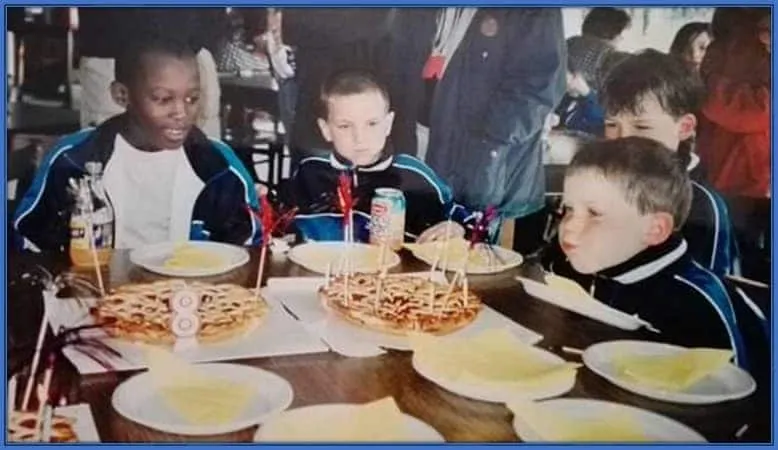 Romelu Lukaku and Vinnie are pictured participating in their school feeding programme. That day was also the birthday of his classmate.
