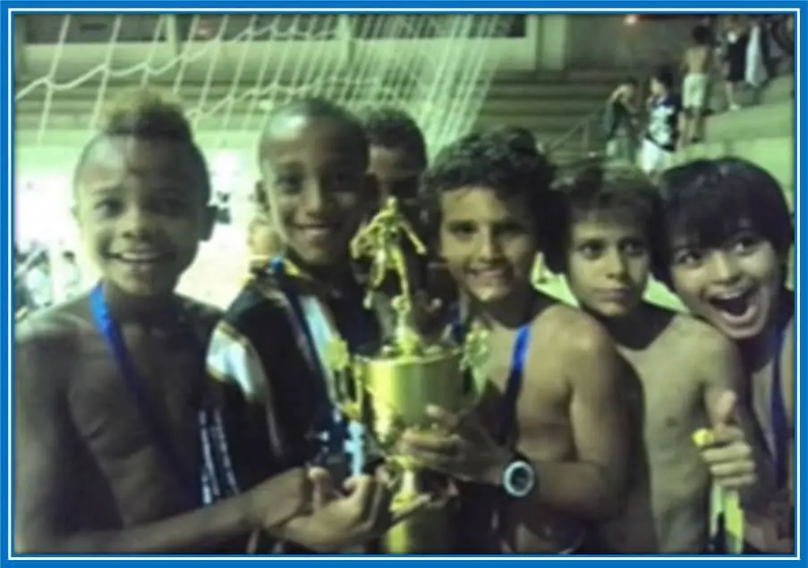 Pedro and his school team celebrating their championship cup after an amazing performance. Image credit: