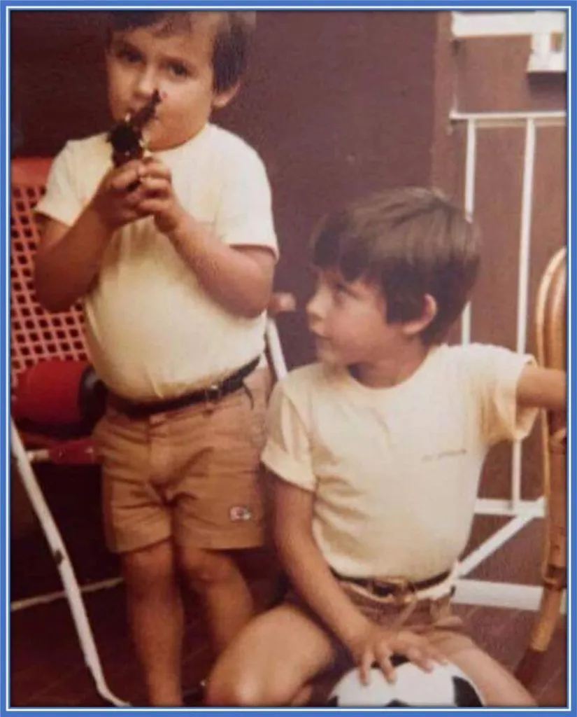 The Inzaghi siblings, Simone and Filippo, sharing a moment in their childhood hometown of San Nicolo, Piacenza. Their close bond, reminiscent of twins, is unmistakable in their matching attire and hairstyles, a testament to their togetherness.