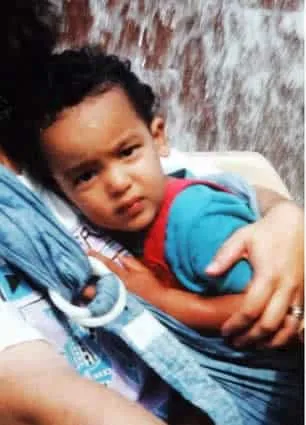 A boyhood photo of Theo Walcott in the loving arms of Lynne, his Mum.