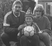 Young David Beckham, alongside his parents in his early years.