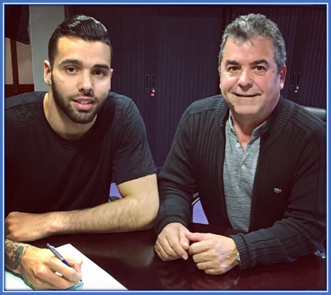 A pix of David Raya with his Dad, signing a deal with Brentford.