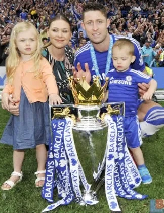 Gary Cahill's wife and children are celebrating one of Chelsea's premier league trophies.