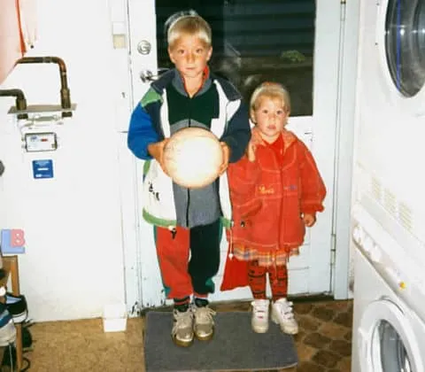 Little Christian Eriksen poses with the ball alongside his kid sister.