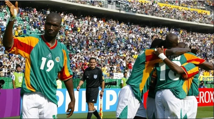 From Dreams to Reality: Sadio Mane's journey from awe-inspired child to football superstar, fueled by Senegal's historic 2002 World Cup triumph over France.
