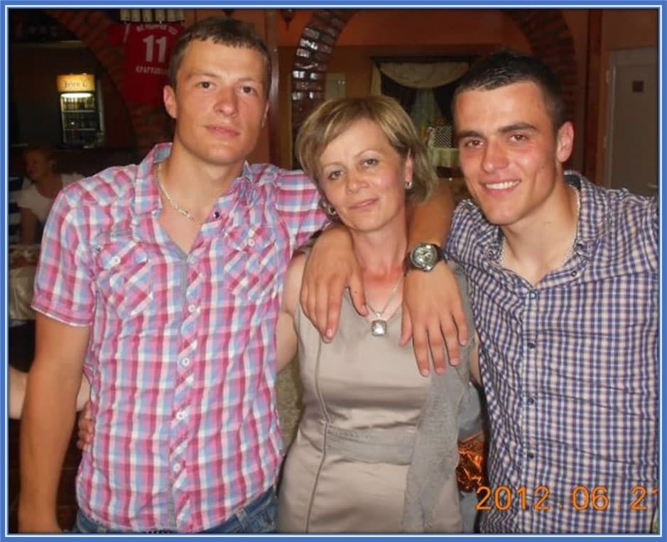 We picture Filip Kostic's Mum here, standing in between him and his brother, Stefan Kostic.