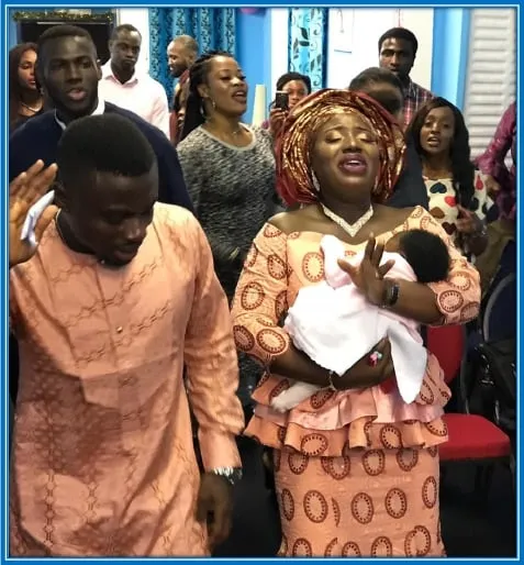 Moses Simon is not only modest but deeply religious. We picture him and his wife (Ibukun) praising God in his Belgium Church. He took the photo during his time at Gent, in Belgium.