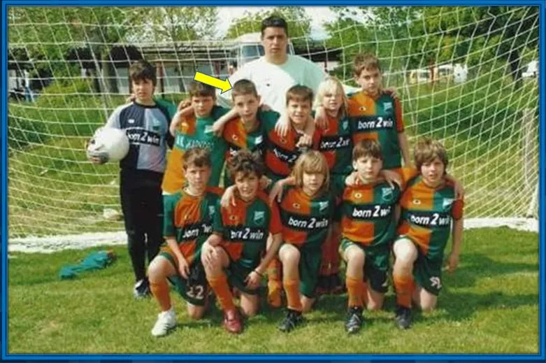 This is Nikola at Škola Fudbala Žarkovo football school. He stood alongside his teammates and his former coach, Nikola Jelic.