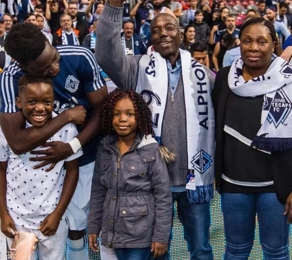 Alphonso Davies with his father, mother and younger siblings.