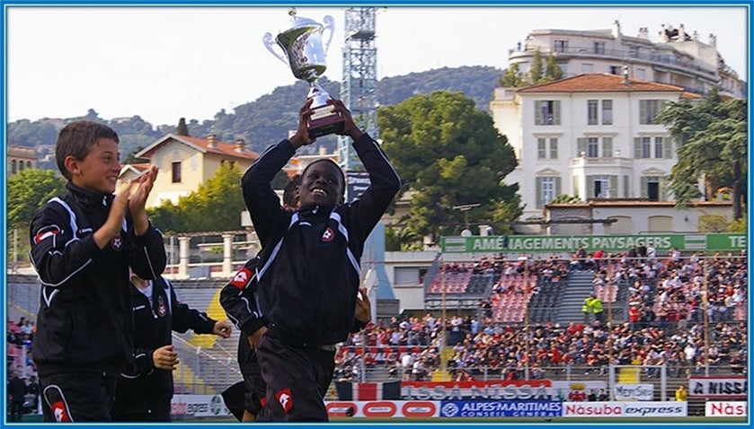 We pictured Malang Sarr celebrating a trophy - in his early career days.