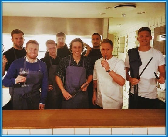 Denmark national team players learning how to cook from Thomas the cook.