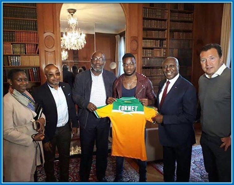 Maxwel Cornet's celebrating his first Ivory Coast shirt with Jean Claude Gba and others.