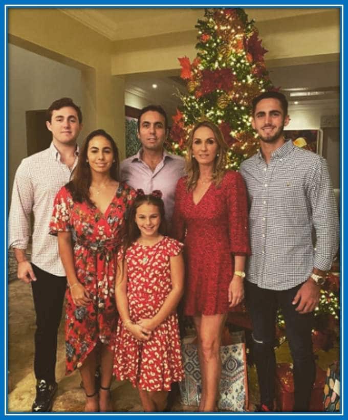 Here, the Campana siblings and their parents celebrate Christmas together.