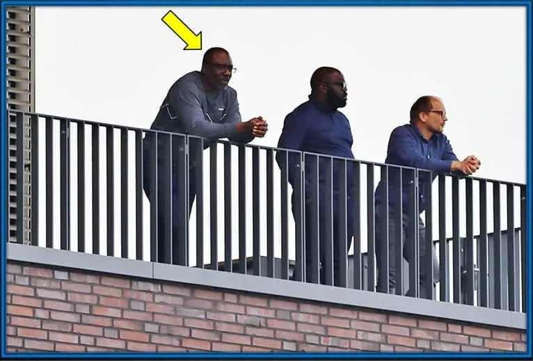 He always finds whats best for his son's career. Noni Madueke's Dad is pictured investigating the Borussia Dortmund facilities.