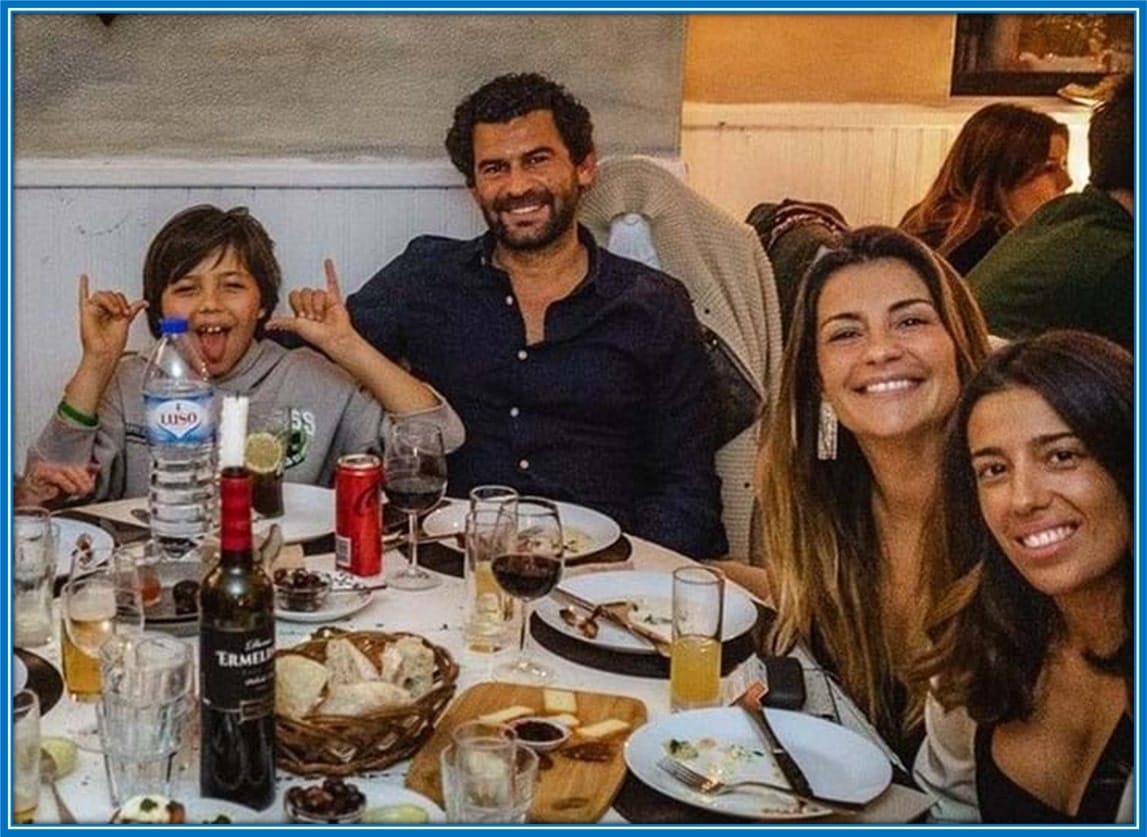Luis Santos, having dinner with loved ones, including Isabel.