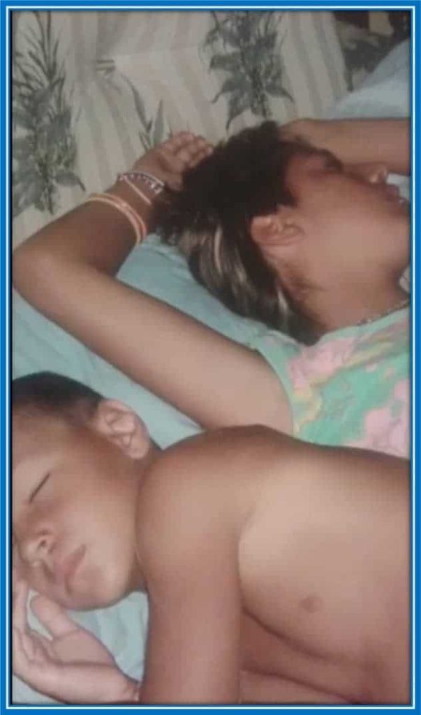 A rare image of young Gianluca and his older sister seeping.
