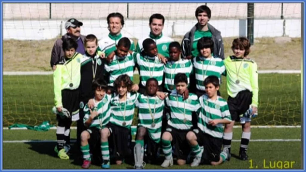 Can you spot the youngster among his teammates?