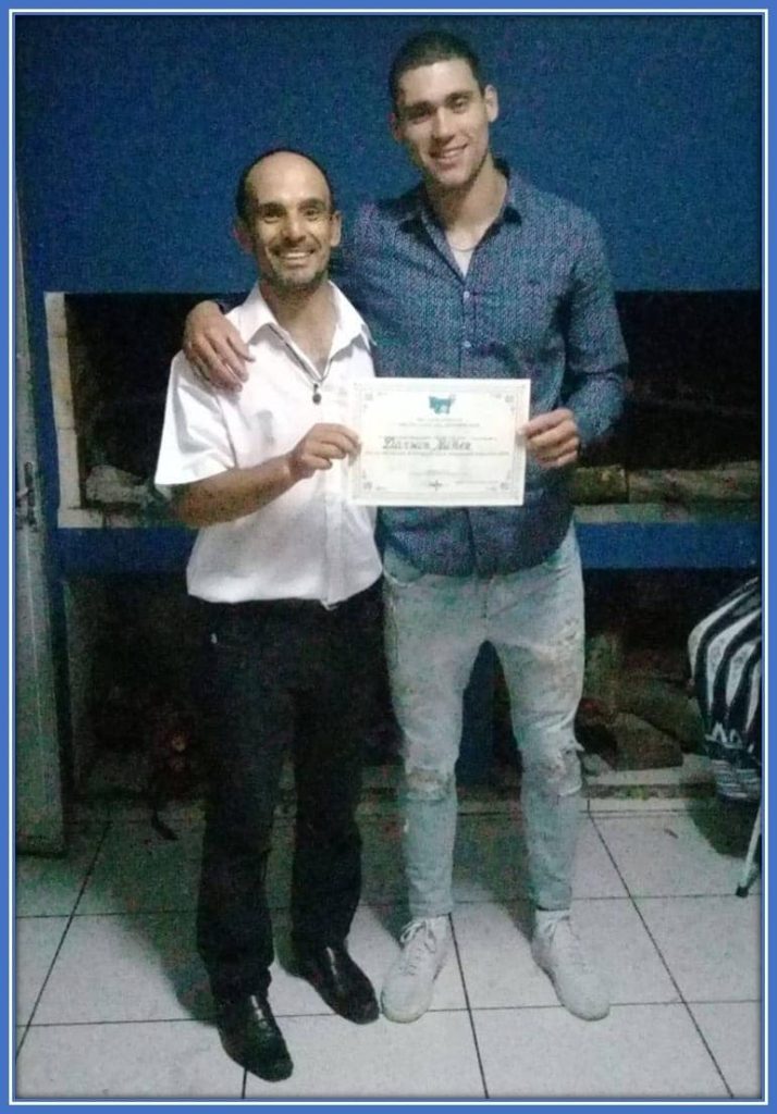 Junior, Darwin Nunez's Brother, is pictured here receiving a certificate of honour for his contribution to national football growth.