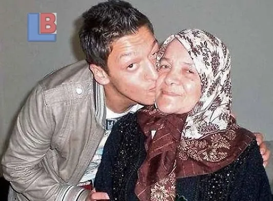 Mesut Ozil takes a loved-up photo with his Mum.