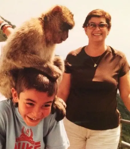 Throwback photo of Ferran Torres with his pet monkey and mother.