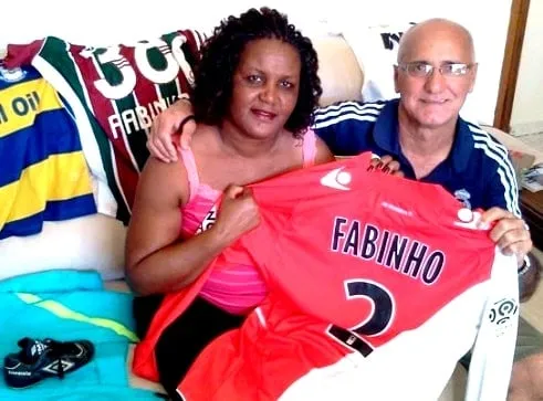 Behold, Fabinho's Mother and Father. Rosangela Tavares and João Roberto Tavares are super proud of what their son has achieved in football.
