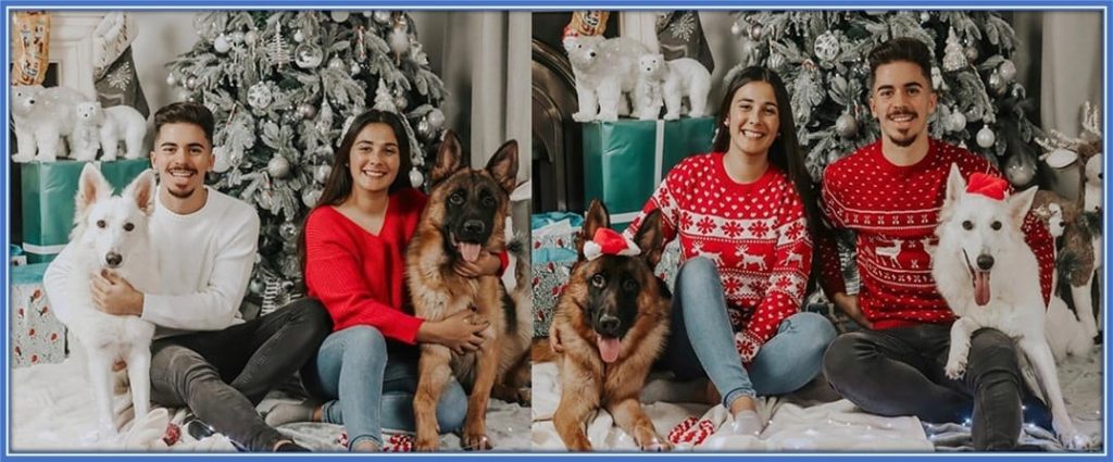 Tatiana Rendeiro Torres and Vitinha pose together with their dogs.
