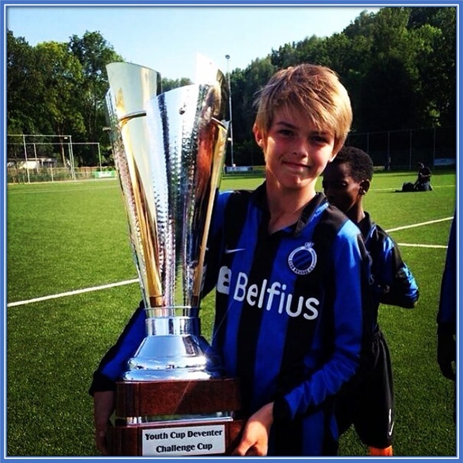 Here is the promising young talent lifting his first trophy at the youth level.