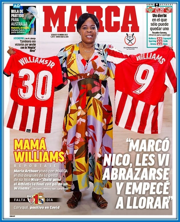 Here, Maria proudly holds the jerseys of her two sons, who play their football with Athletic Bilbao.
