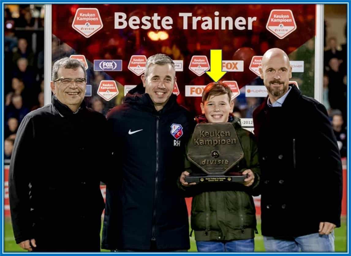 In this photo, Erik ten Hag's son holds the Keuken Kampioen - also known as the Eerste Divisie title. His Legendary Dad won this great honour.