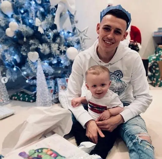 Phil Foden pictured celebrating Christmas with his son. Image Credit: Instagram