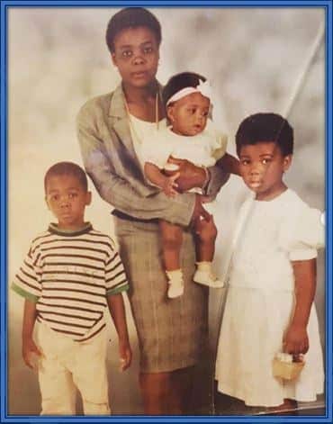 Meet Angelo Ogbonna as a child, pictured alongside his mother and sisters - Paola and Emily.