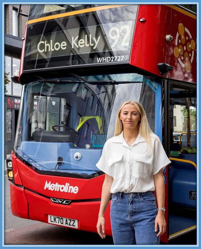 Chloe Kelly beams with smiles as she stands beside the metro bus bearing her name, heartfelt recognition of her incredible journey and accomplishments in football. Image: Instagram/Chloekelly