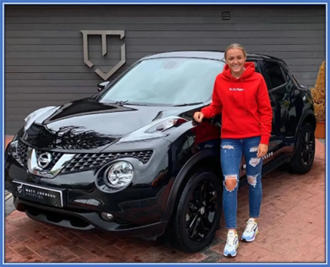 What better way to show off your car than this? The athlete is standing beside one of her sleek automobiles. Image Credit: Instagram.com/stanwaygeorgia