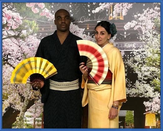 Embracing Cultural Diversity: Laura and Angelo Ogbonna, dressed in vibrant Asian attire, celebrate their love for different cultures and traditions with style and grace