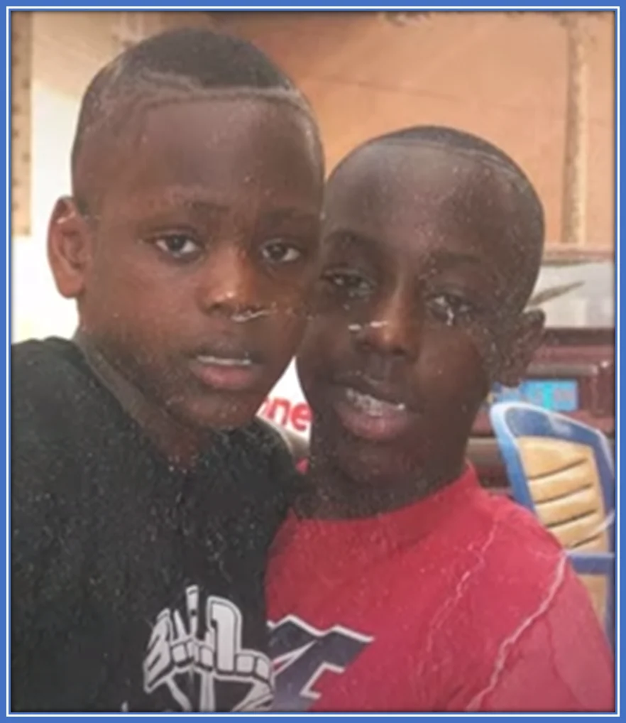An early childhood pix of Yoane Wissa with one of his brothers.