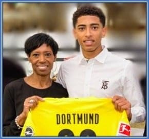 Jude Bellingham's Mother, Denice, is pictured celebrating her son's Dortmund signing.
