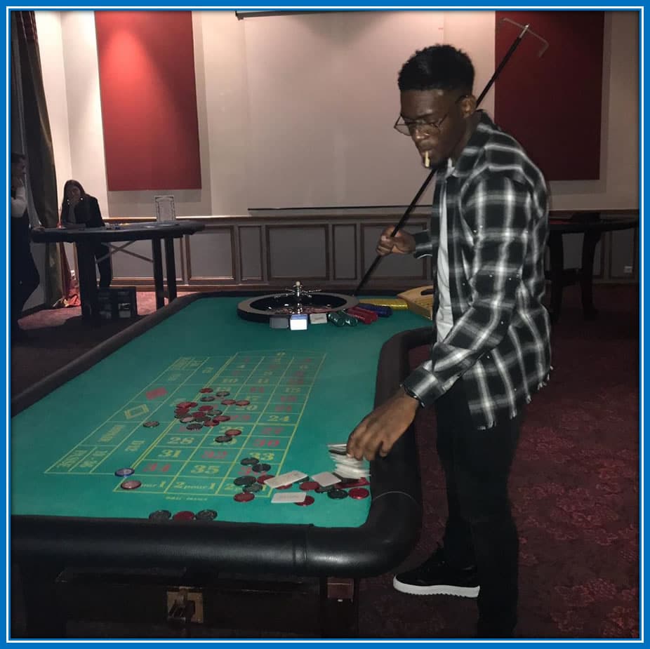 Beyond the pitch: Disasi's intense focus during a poker game mirrors his football determination.