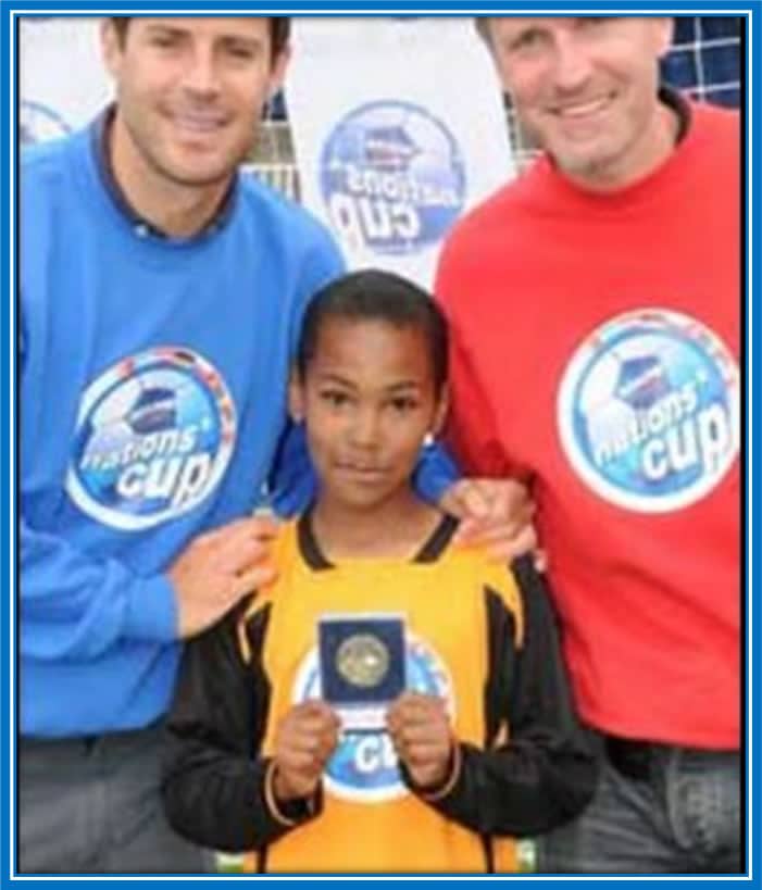 See Antonio with organizers of the Mini- Nations Cup when he was 11. Photo Credit: Birmingham Mail.
