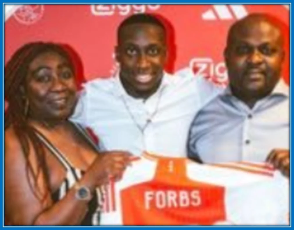 Carlos Forbs and his parents.