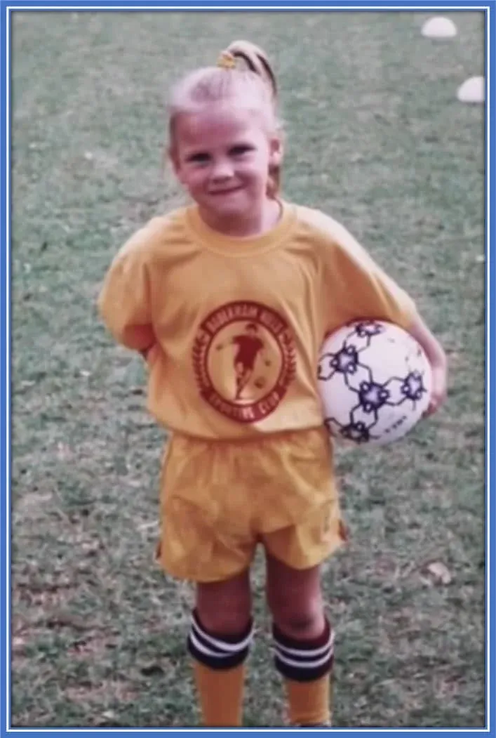 This is a photo of a younger Emily van Egmond. Her love for soccer can be seen in the picture. Image Credit: Matildas.com.