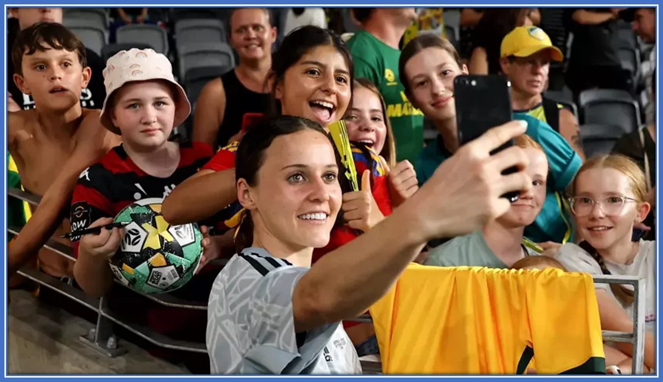 Hayley Raso taking a selfie with her fans.