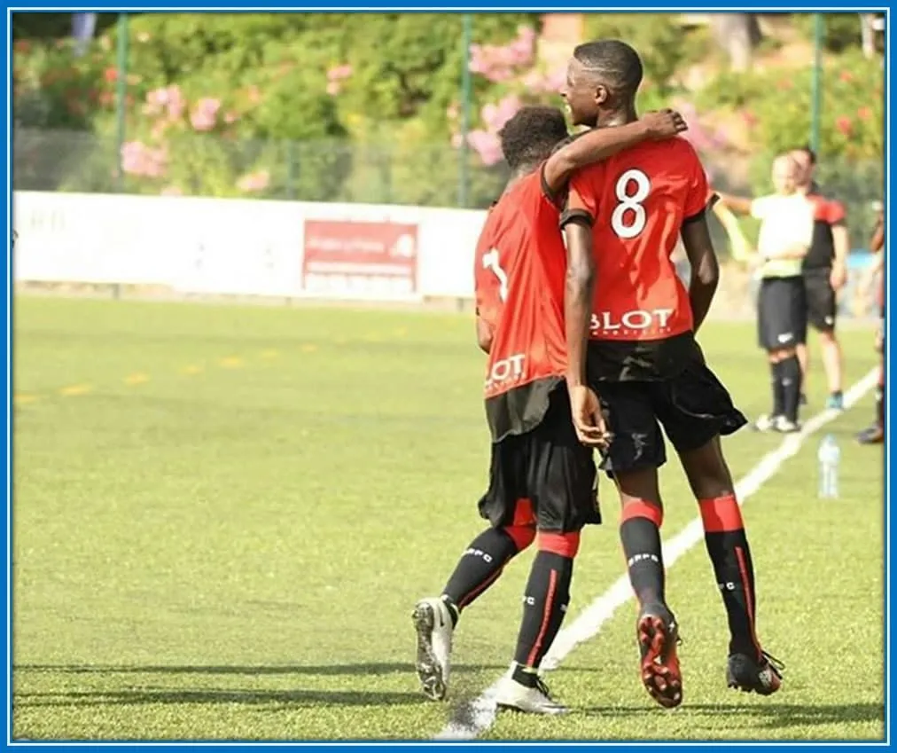 Capturing his distinctive height during that era. A very tall looking Lesley is pictured celebrating a goal, standing head and shoulders above his teammate.