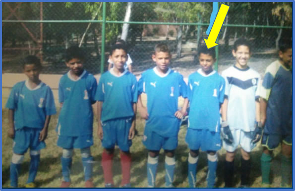Here is the Central Midfielder with his teammates. Photo, 